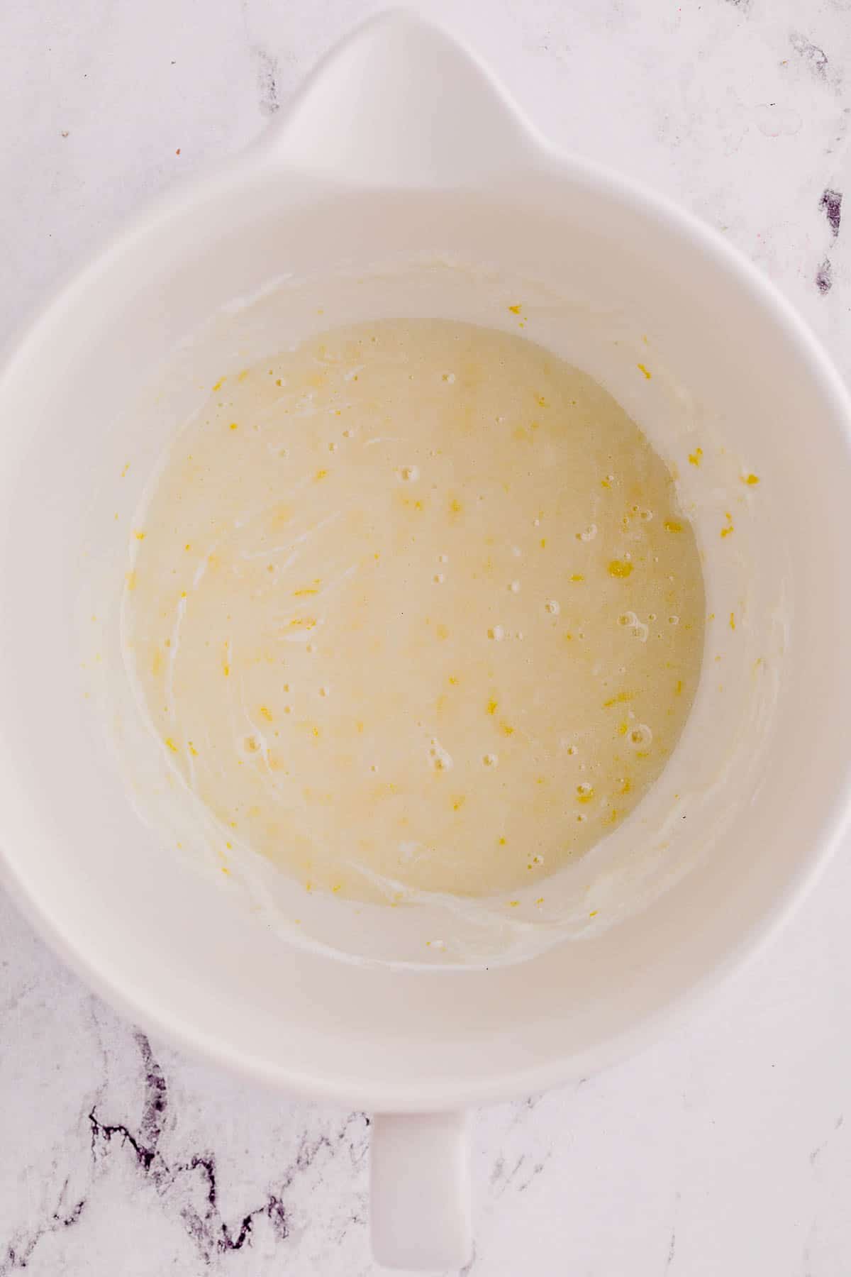 greek yogurt, lemon juice and vanilla extract whisked into egg, oil and sugar mixture