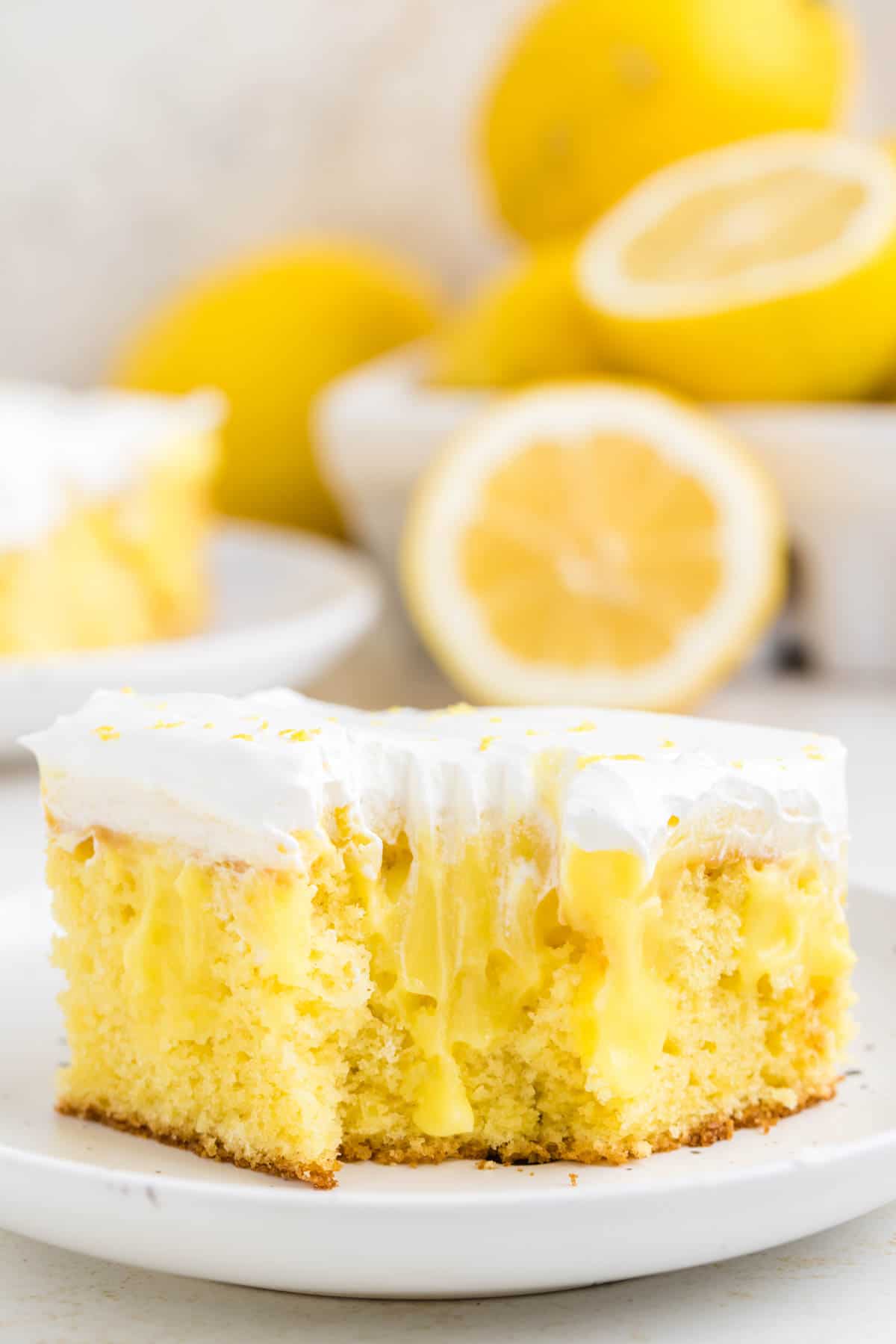 Lemon Poke Cake is a sweety and tangy dessert recipe made with boxed lemon cake mix, lemon instant pudding mix and Cool Whip.