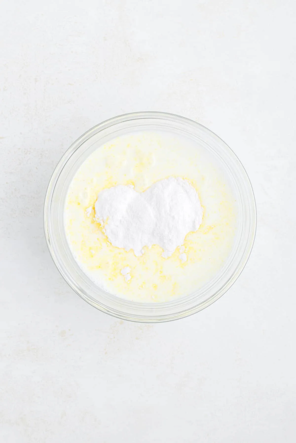 milk and instant lemon pudding mix in a bowl