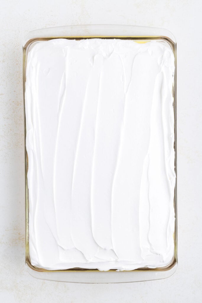 Cool Whip spread over lemon cake