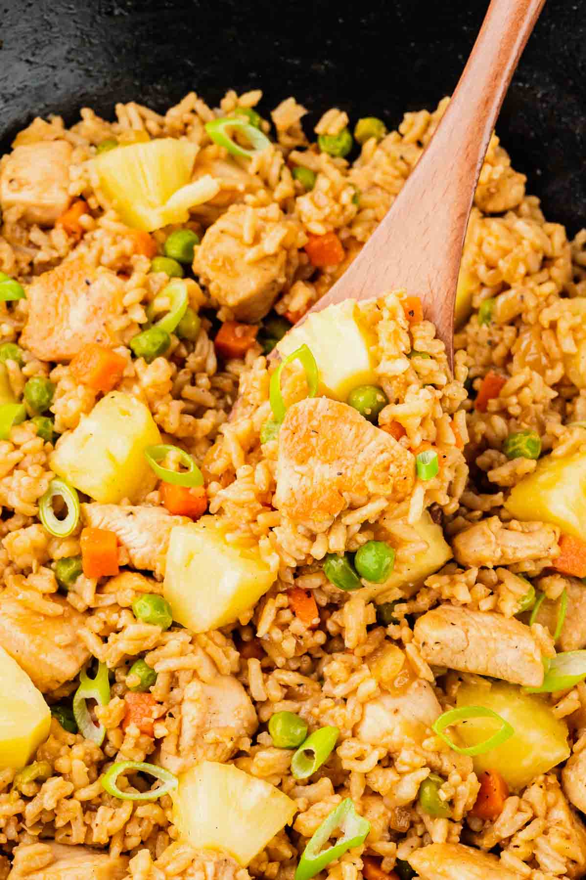 Pineapple Chicken Fried Rice is the perfect balance of sweet and savoury with pineapple chunks, diced chicken breast pieces and rice all seasoned with soy sauce, hoisin sauce and toasted sesame oil.