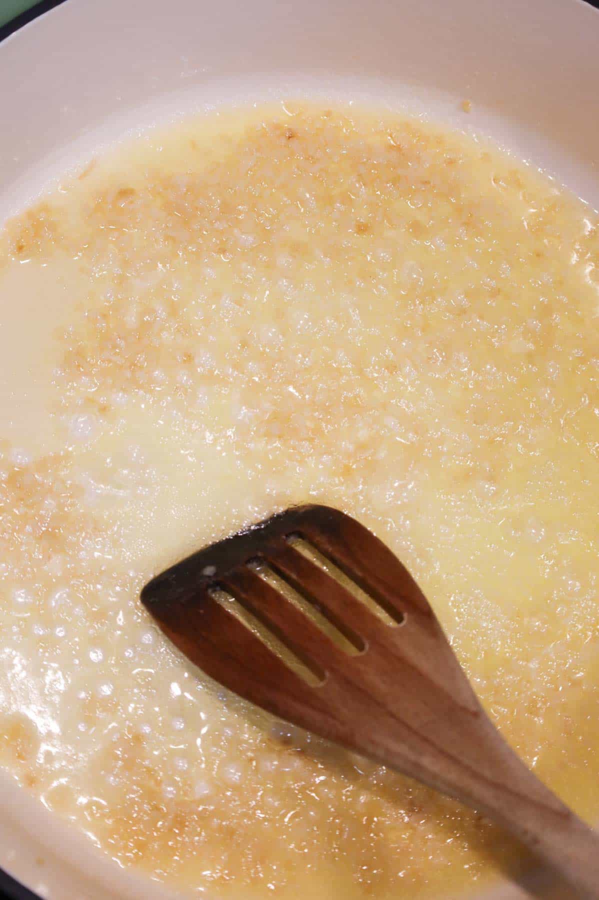 melted butter and minced garlic in a skillet