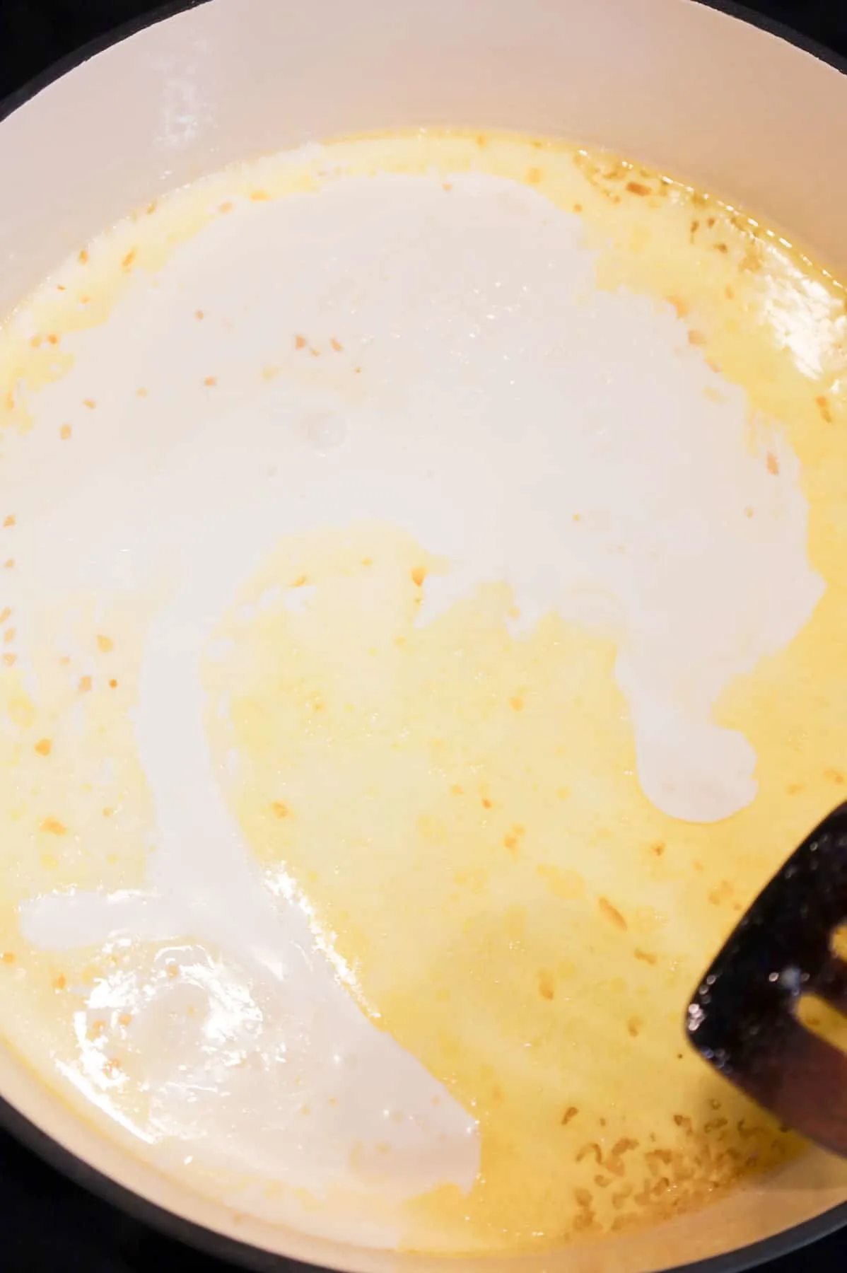 butter, garlic and heavy cream in a skillet