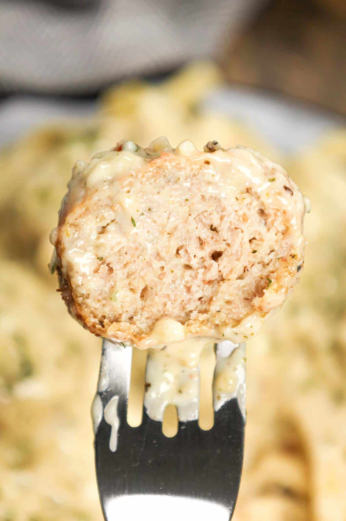 Alfredo Meatballs are an easy ground chicken meatball recipe loaded with Italian seasoned bread crumbs, garlic powder and parmesan cheese and tossed in a rich and creamy alfredo sauce.