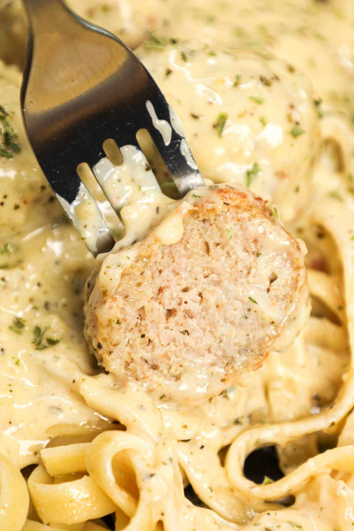 Alfredo Meatballs are an easy ground chicken meatball recipe loaded with Italian seasoned bread crumbs, garlic powder and parmesan cheese and tossed in a rich and creamy alfredo sauce.