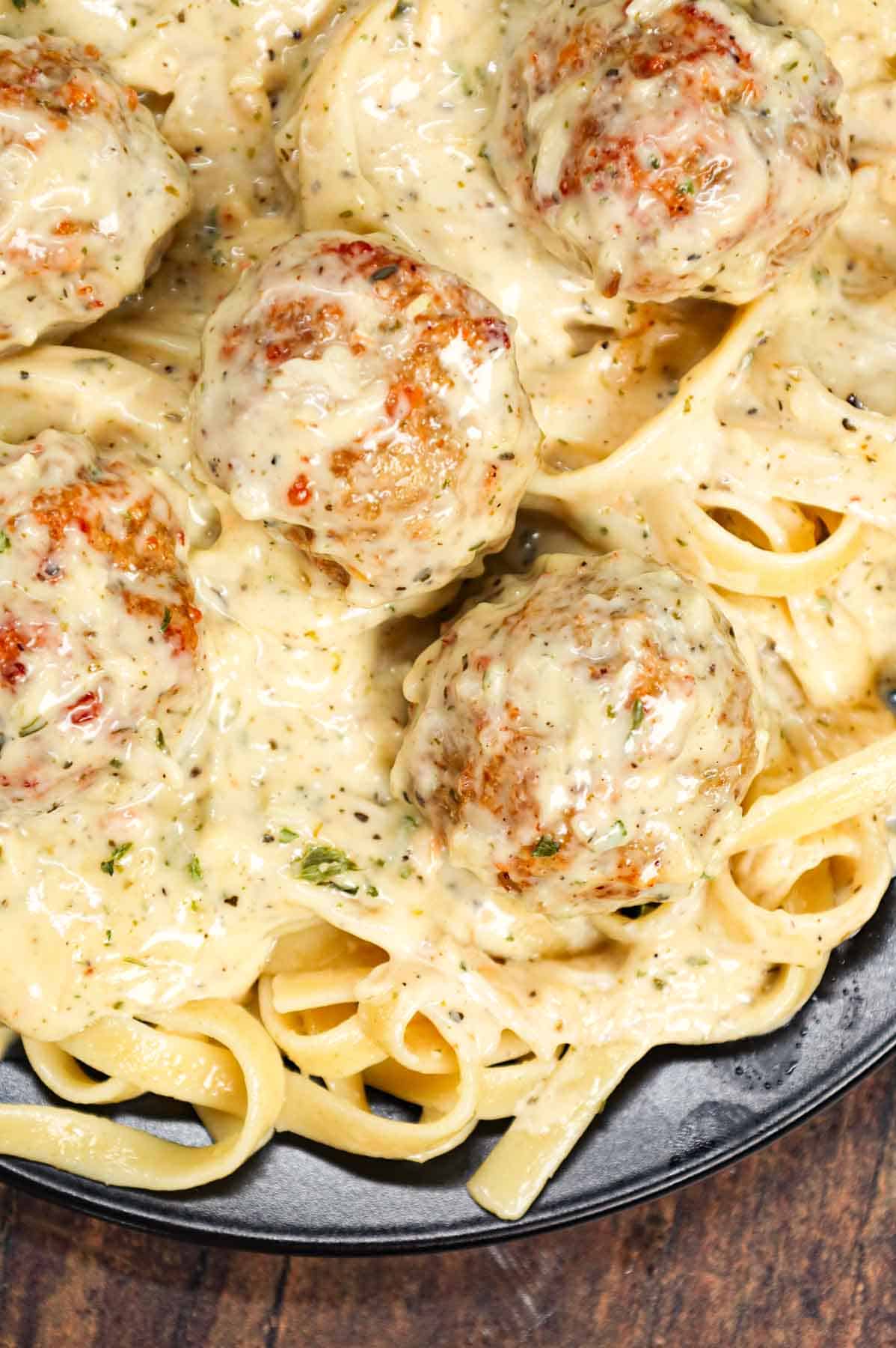 Alfredo Meatballs are an easy ground chicken meatball recipe loaded with Italian seasoned bread crumbs, garlic powder and parmesan cheese and tossed in a rich and creamy alfredo sauce.