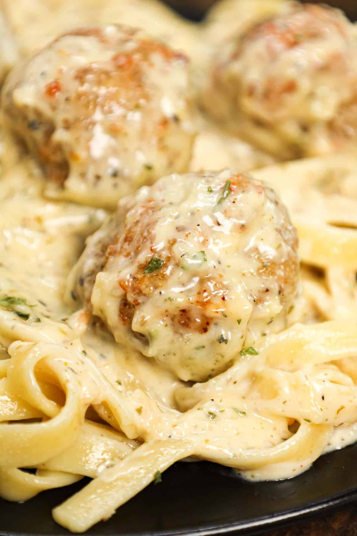 Alfredo Meatballs are an easy ground chicken meatball recipe loaded with Italian seasoned bread crumbs, garlic powder and parmesan cheese and tossed in a rich and creamy alfredo sauce.