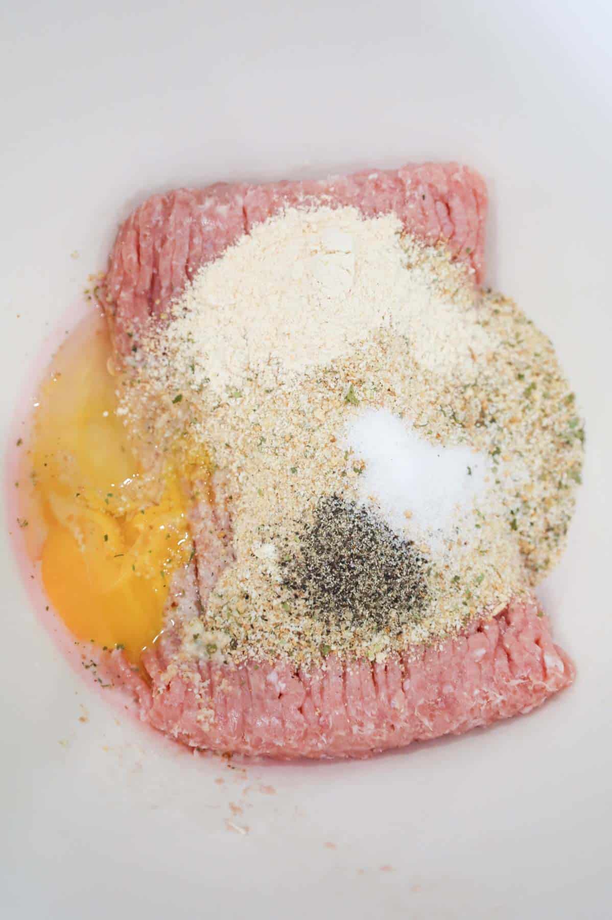 ground chicken, egg, bread crumbs and spices in a bowl