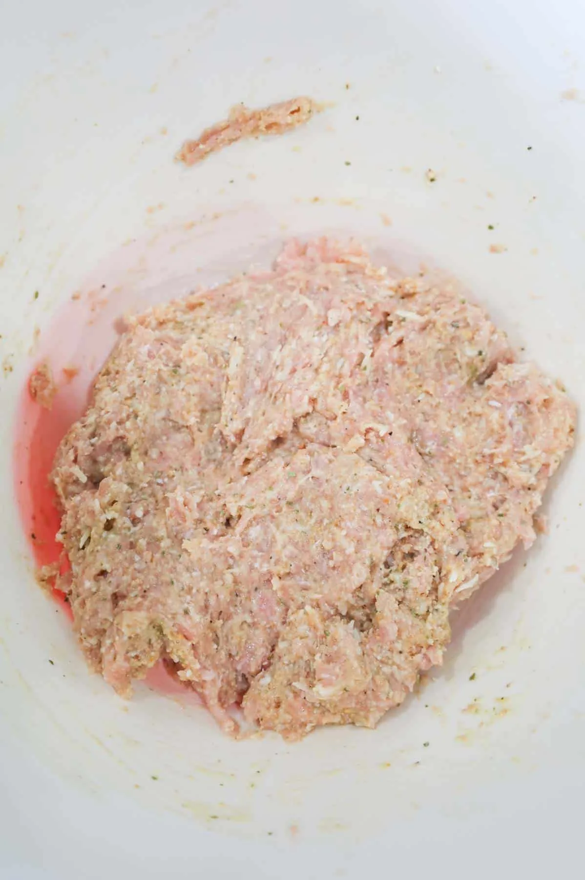 ground chicken meatball mixture in a bowl