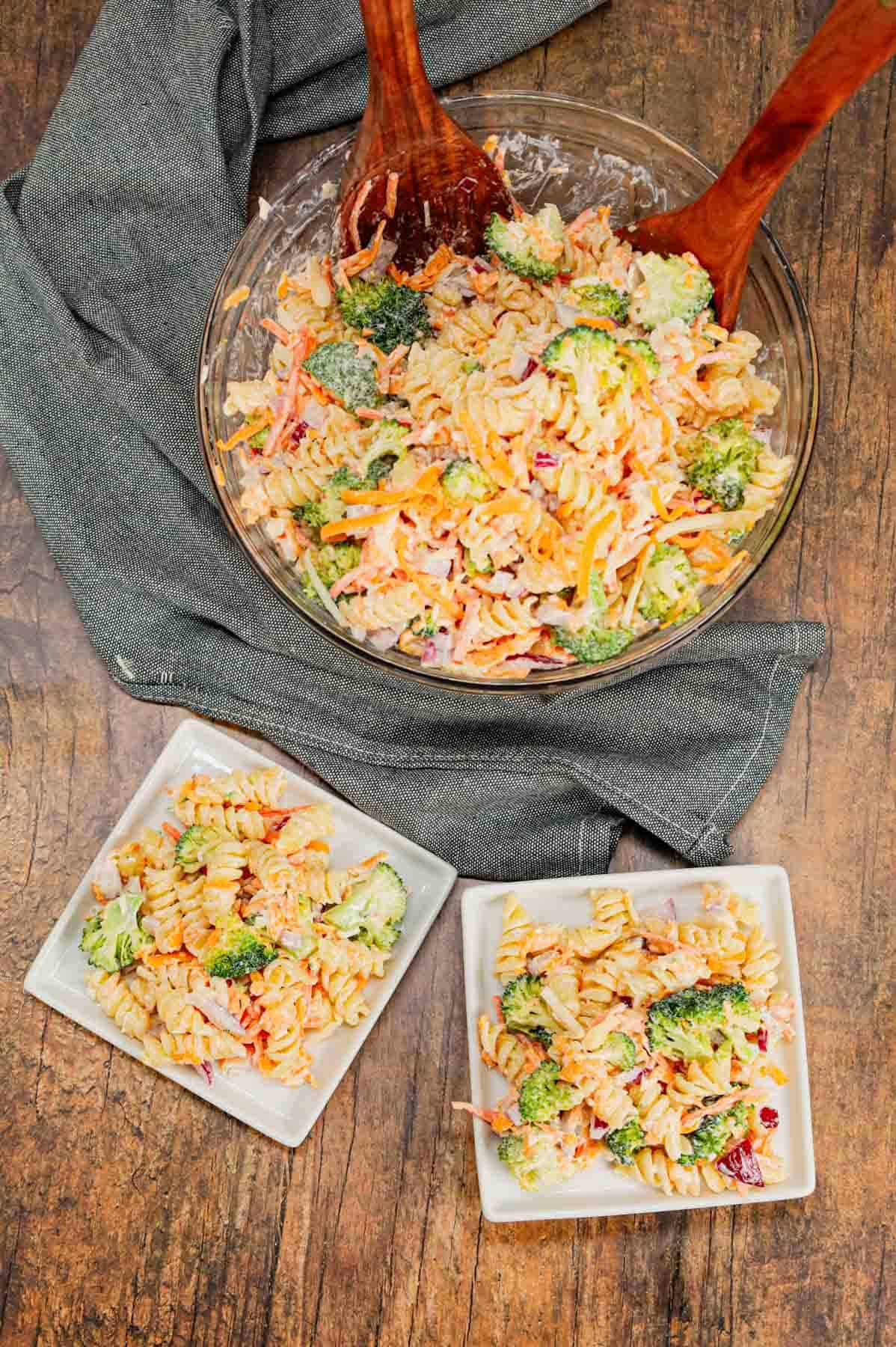 Broccoli Cheddar Pasta Salad is a tasty cold side dish recipe loaded with rotini pasta, broccoli florets, red onions, shredded carrots, cheddar cheese and parmesan all tossed in a mayo and ranch dressing mixture.