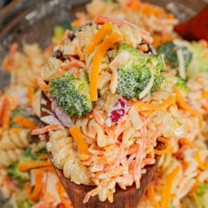 Broccoli Cheddar Pasta Salad is a tasty cold side dish recipe loaded with rotini pasta, broccoli florets, red onions, shredded carrots, cheddar cheese and parmesan all tossed in a mayo and ranch dressing mixture.