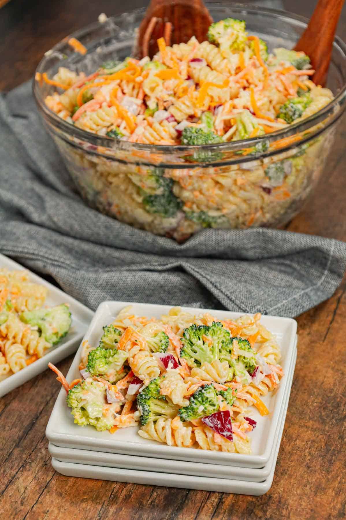 Broccoli Cheddar Pasta Salad is a tasty cold side dish recipe loaded with rotini pasta, broccoli florets, red onions, shredded carrots, cheddar cheese and parmesan all tossed in a mayo and ranch dressing mixture.