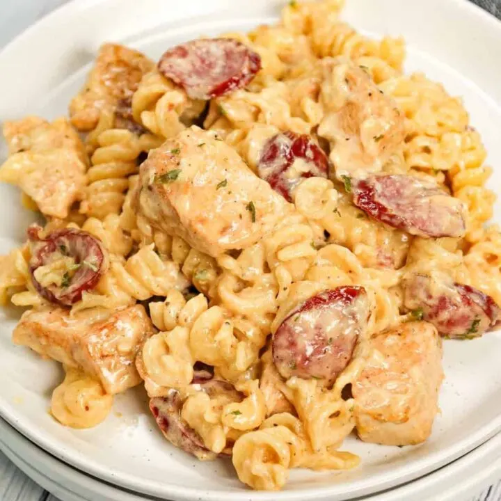 Chicken and Sausage Alfredo is a hearty pasta dish loaded with chunks of chicken breast and smoked sausage slices all tossed in a creamy garlic parmesan sauce with a hint of Cajun seasoning.