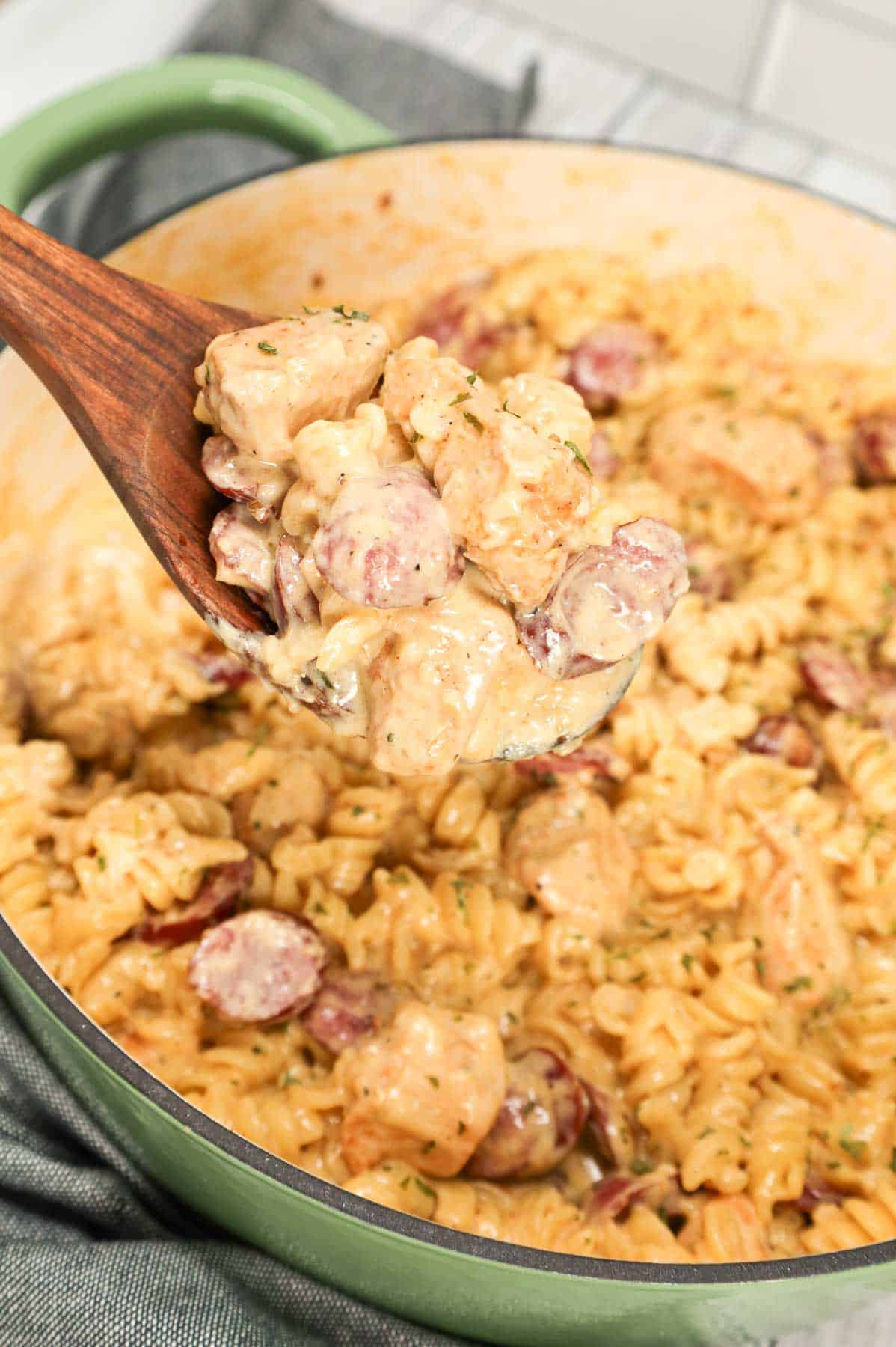 Chicken and Sausage Alfredo is a hearty pasta dish loaded with chunks of chicken breast and smoked sausage slices all tossed in a creamy garlic parmesan sauce with a hint of Cajun seasoning.