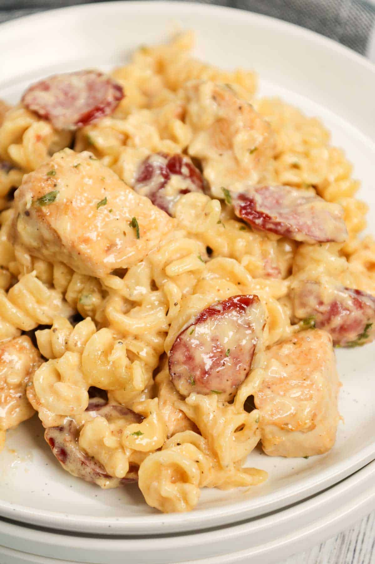 Chicken and Sausage Alfredo is a hearty pasta dish loaded with chunks of chicken breast and smoked sausage slices all tossed in a creamy garlic parmesan sauce with a hint of Cajun seasoning.