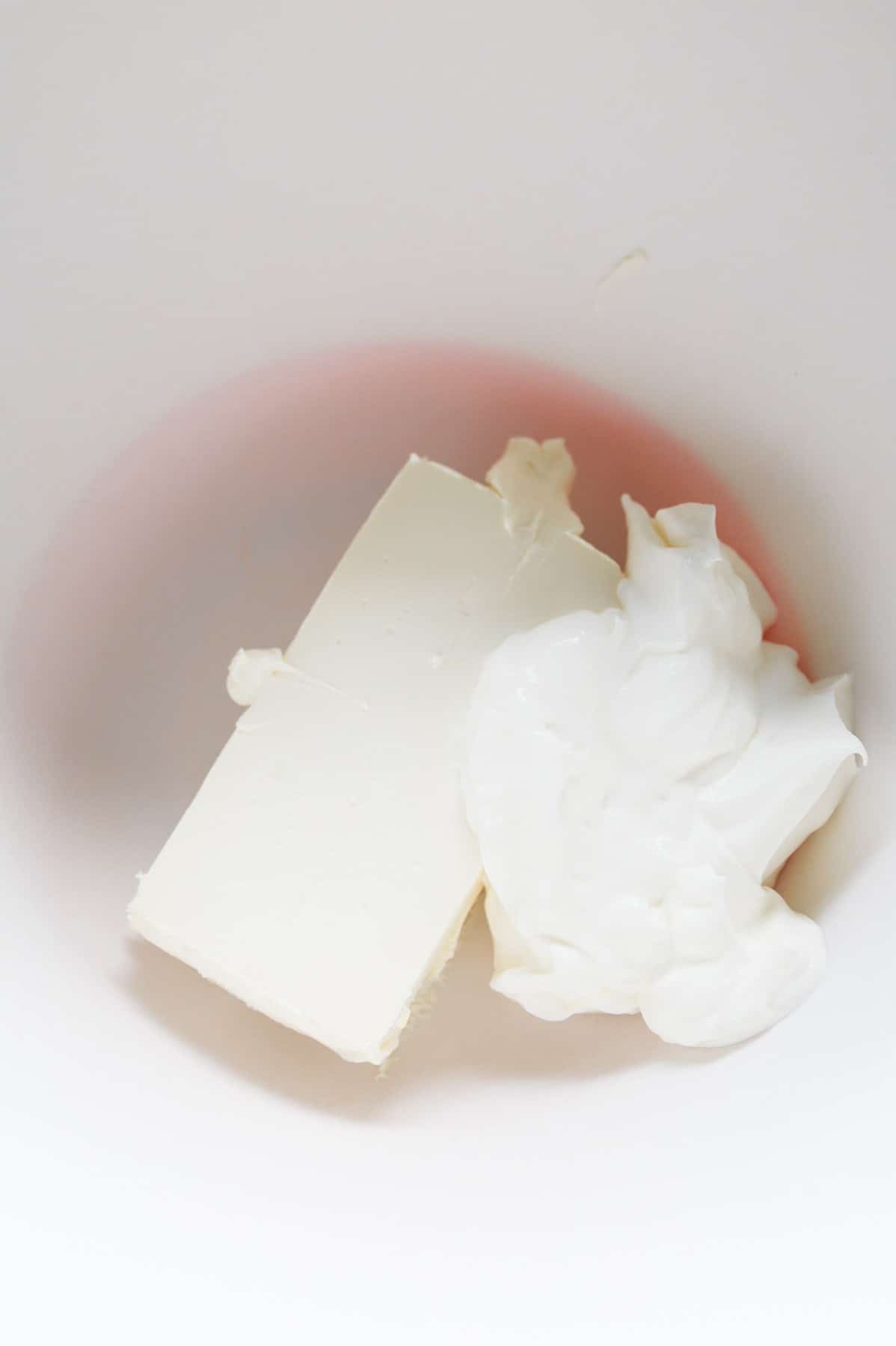 sour cream and cream cheese in a mixing bowl