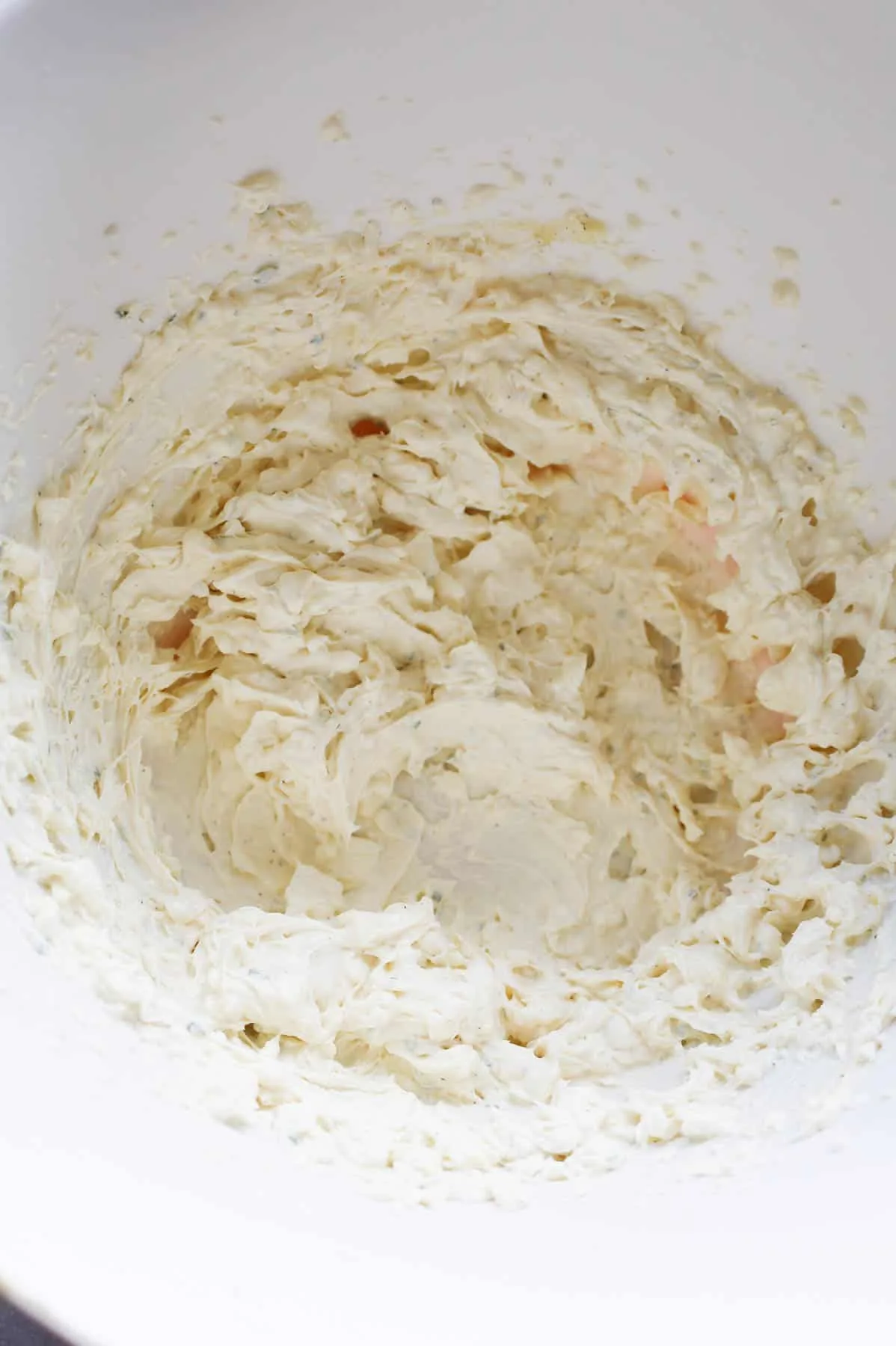 sour cream and cream cheese mixture in a mixing bowl