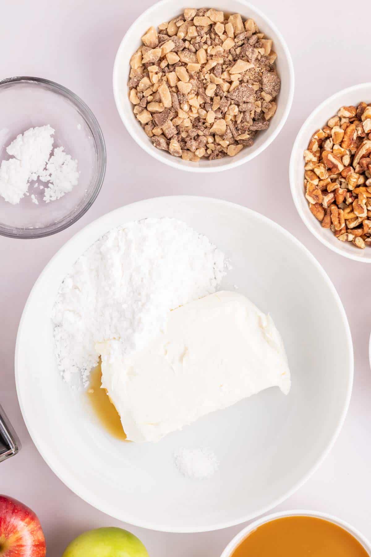 powdered sugar and cream cheese in a mixing bowl