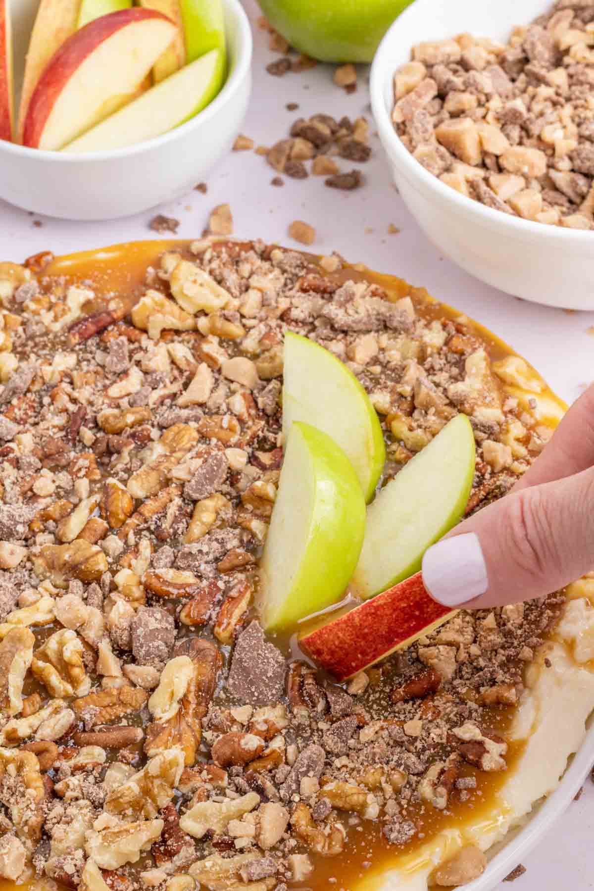 Cream Cheese Caramel Apple Dip is a fun and easy dessert recipe using cream cheese, powdered sugar, caramel sauce, chopped nuts and toffee pieces.