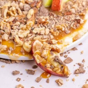 Cream Cheese Caramel Apple Dip is a fun and easy dessert recipe using cream cheese, powdered sugar, caramel sauce, chopped nuts and toffee pieces.