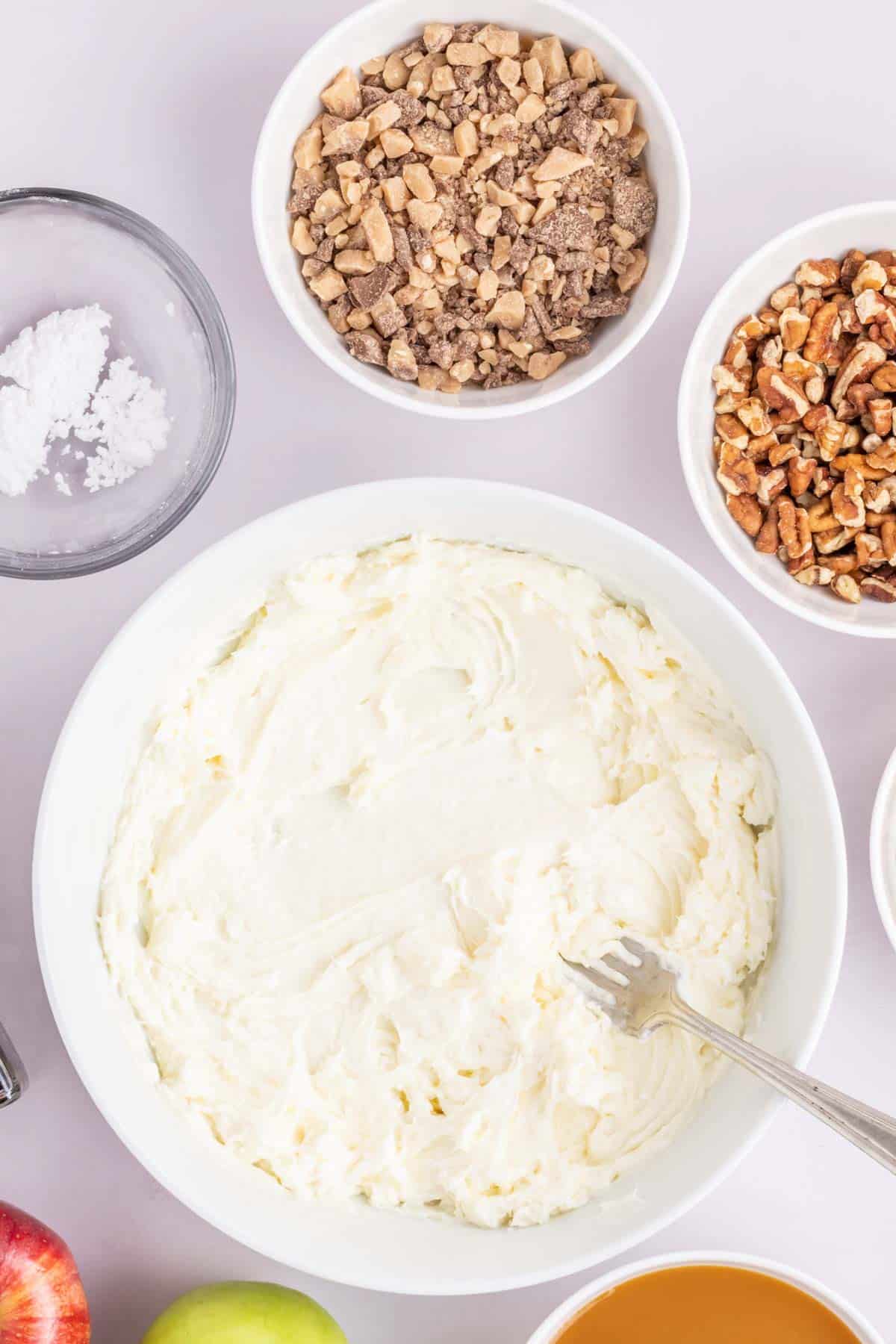 stirring cream cheese mixture with a fork