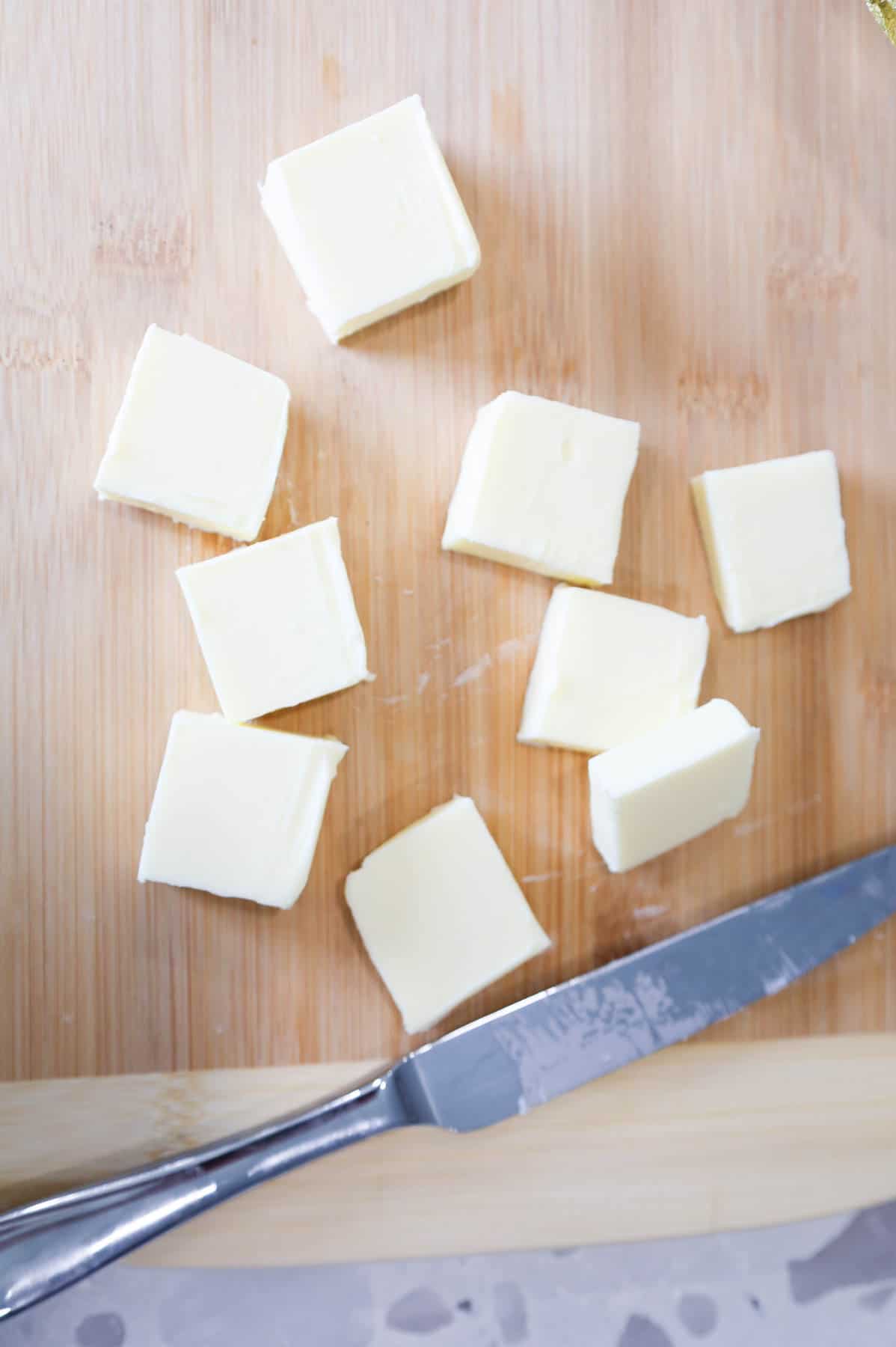 squares of butter on a cutting board