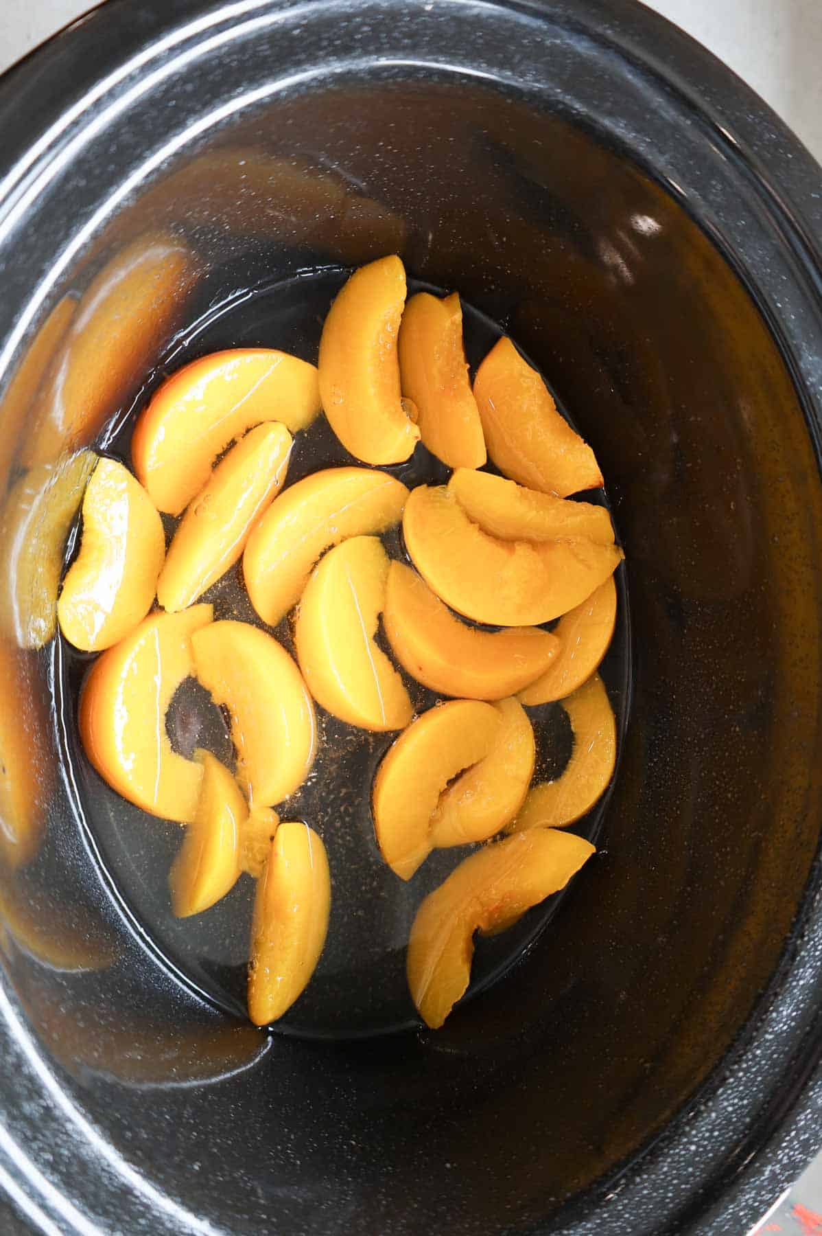 canned peach slices in a crock pot