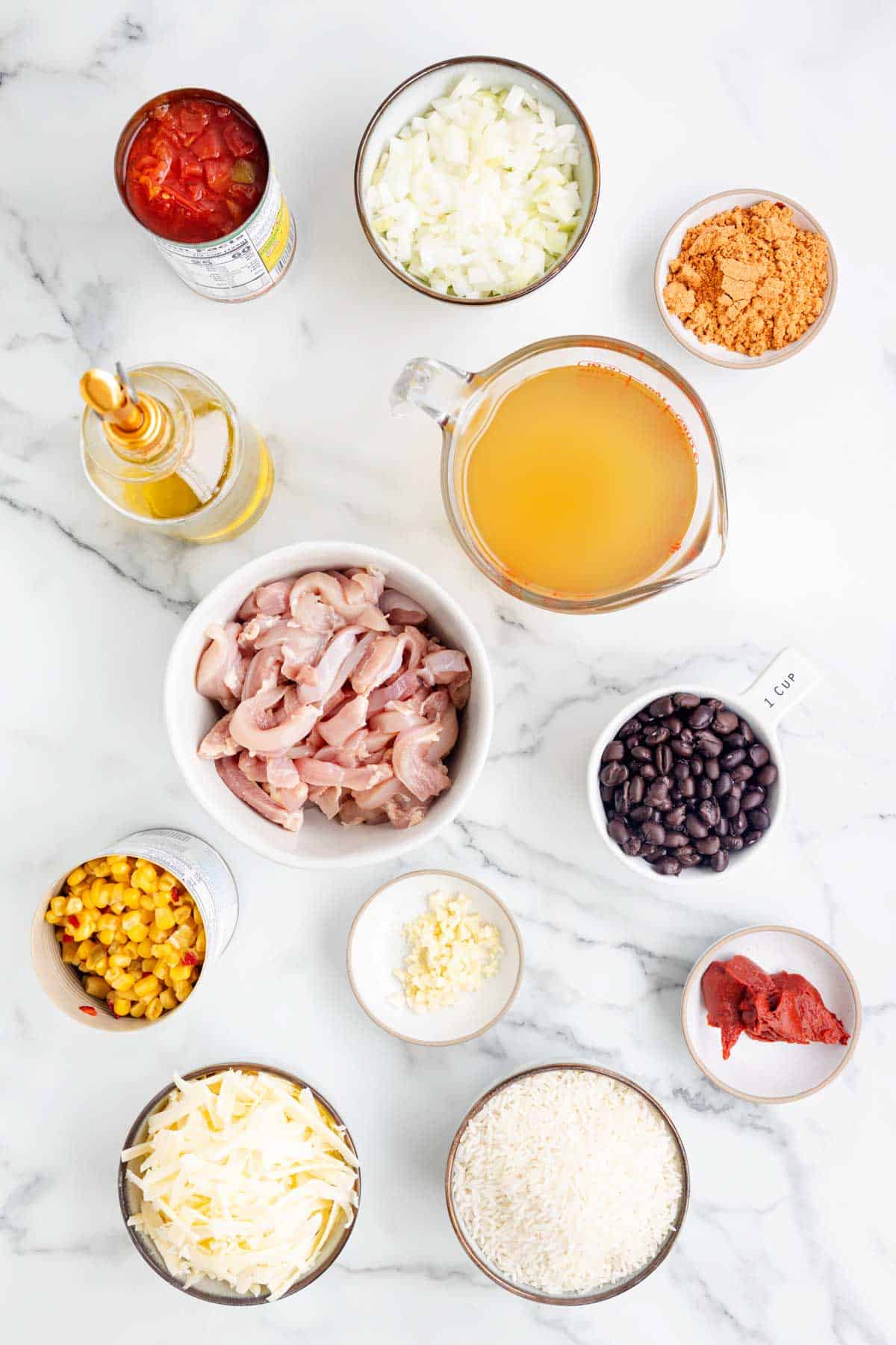 cheesy taco chicken and rice ingredients in prep bowls