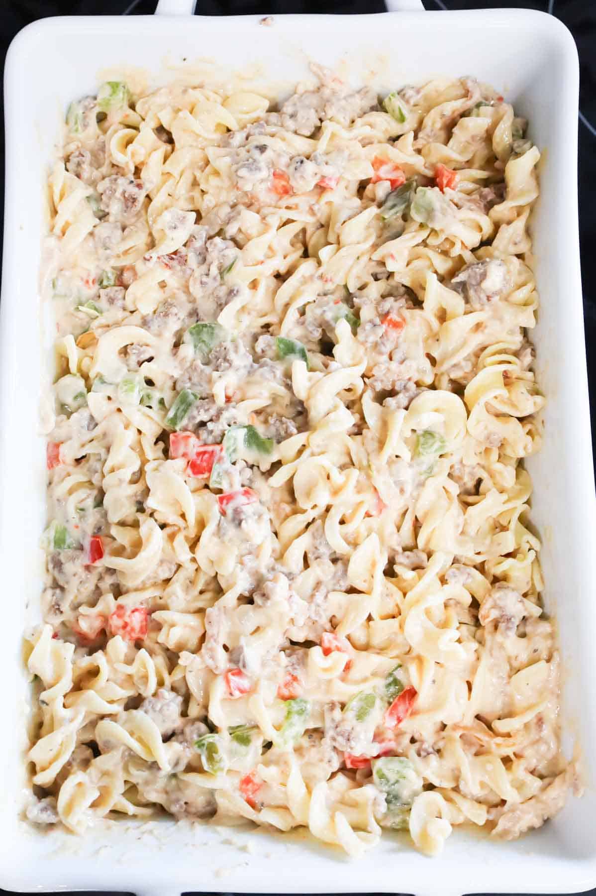 creamy sausage noodle mixture in a baking dish