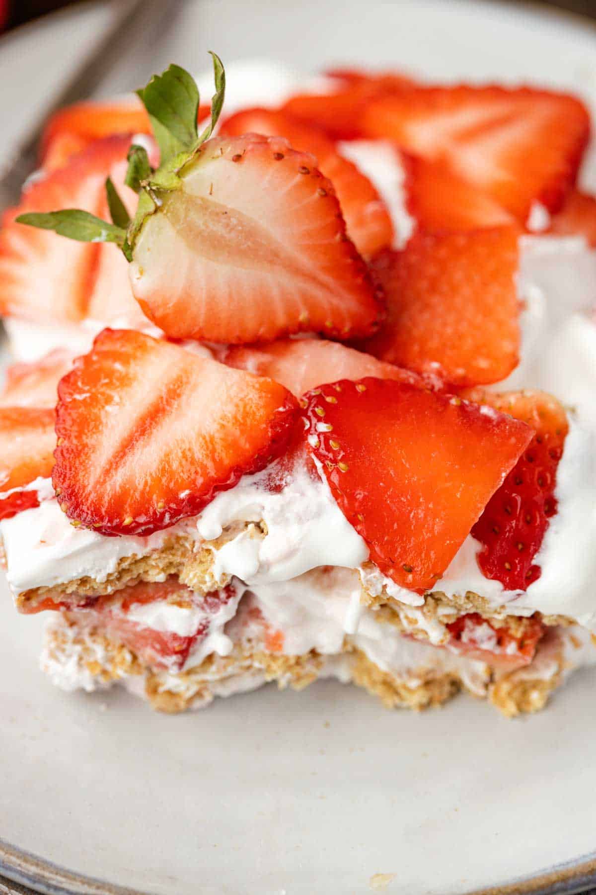 Strawberry Icebox Cake is a 3 ingredient no bake dessert recipe made with graham crackers, Cool Whip and fresh strawberries.