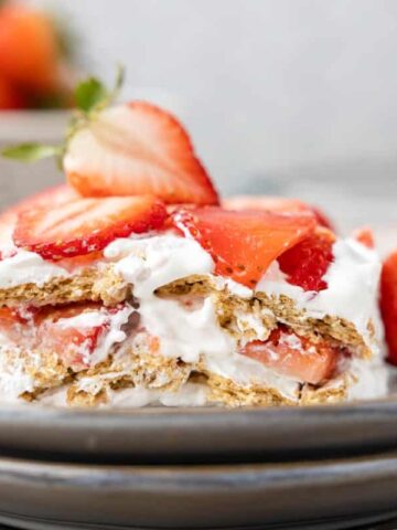 Strawberry Icebox Cake is a 3 ingredient no bake dessert recipe made with graham crackers, Cool Whip and fresh strawberries.