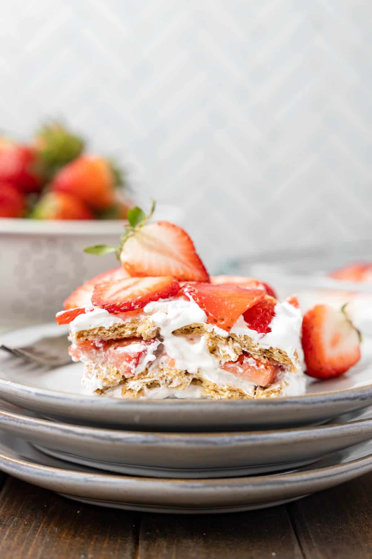 Strawberry Icebox Cake is a 3 ingredient no bake dessert recipe made with graham crackers, Cool Whip and fresh strawberries.