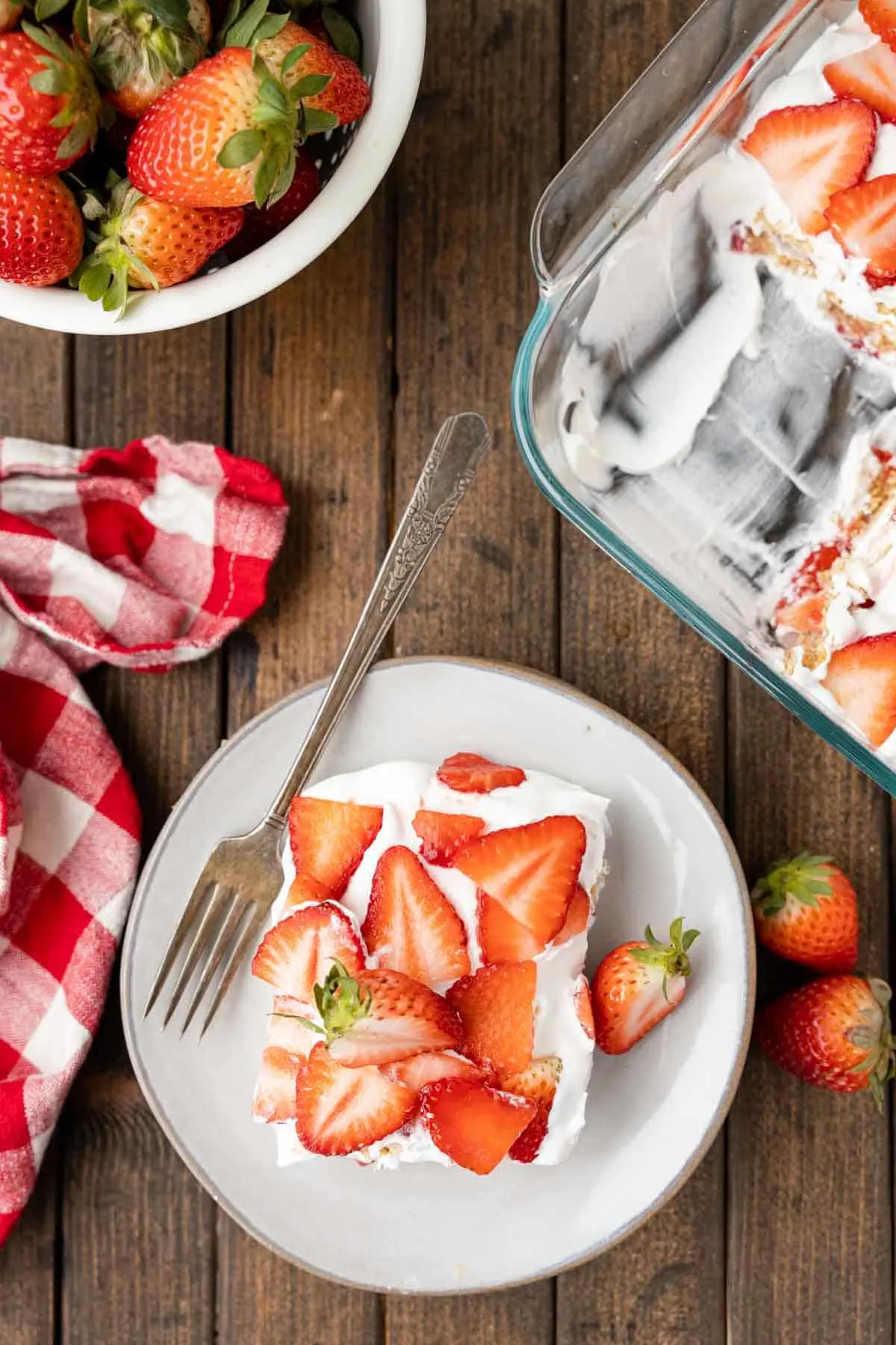 Strawberry Icebox Cake is a 3 ingredient no bake dessert recipe made with graham crackers, Cool Whip and fresh strawberries.