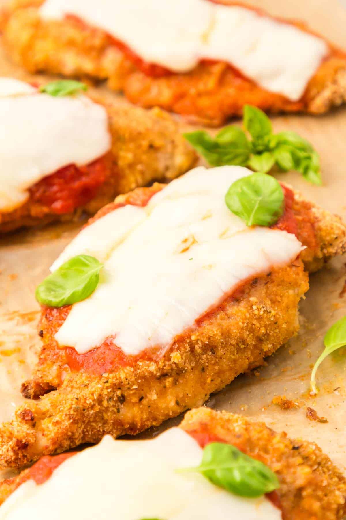 Oven Baked Chicken Parmesan is a delicious parmesan breaded chicken breast recipe topped with marinara and mozzarella cheese.