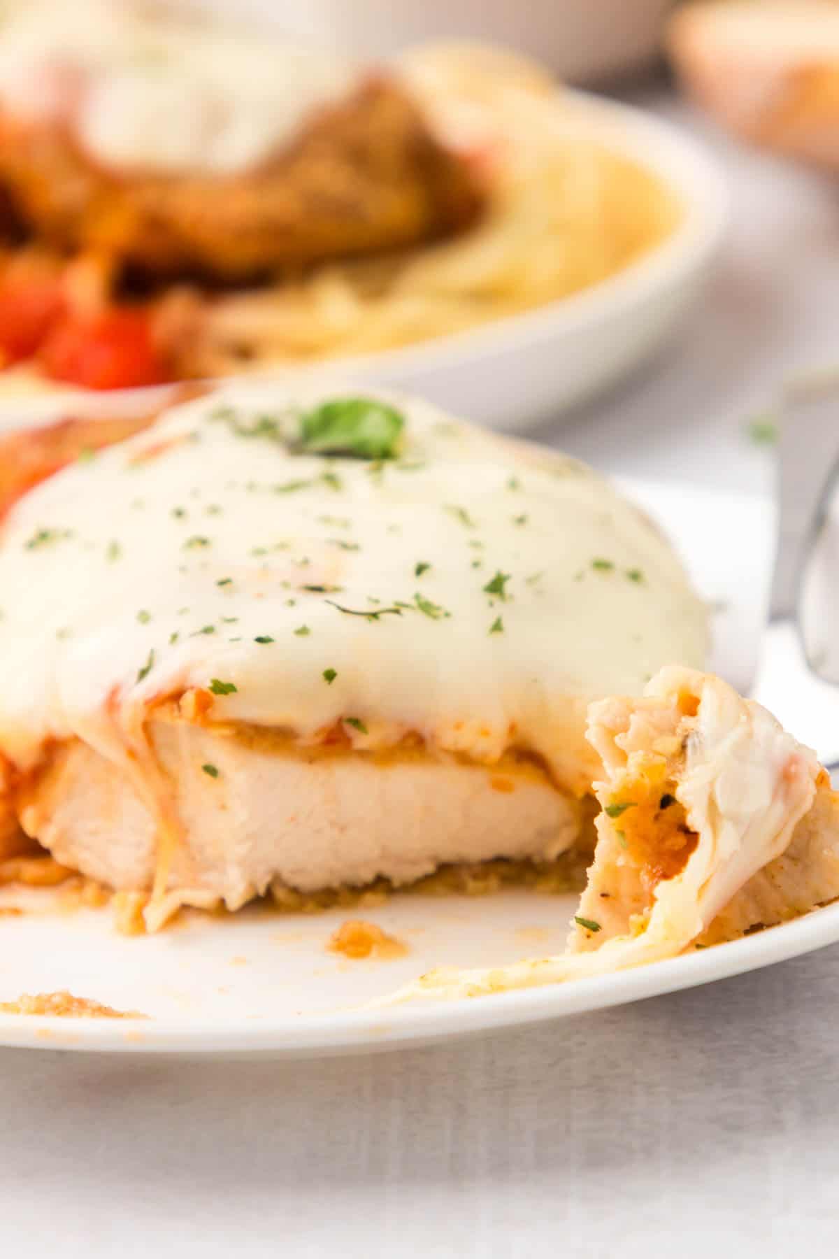 Oven Baked Chicken Parmesan is a delicious parmesan breaded chicken breast recipe topped with marinara and mozzarella cheese.