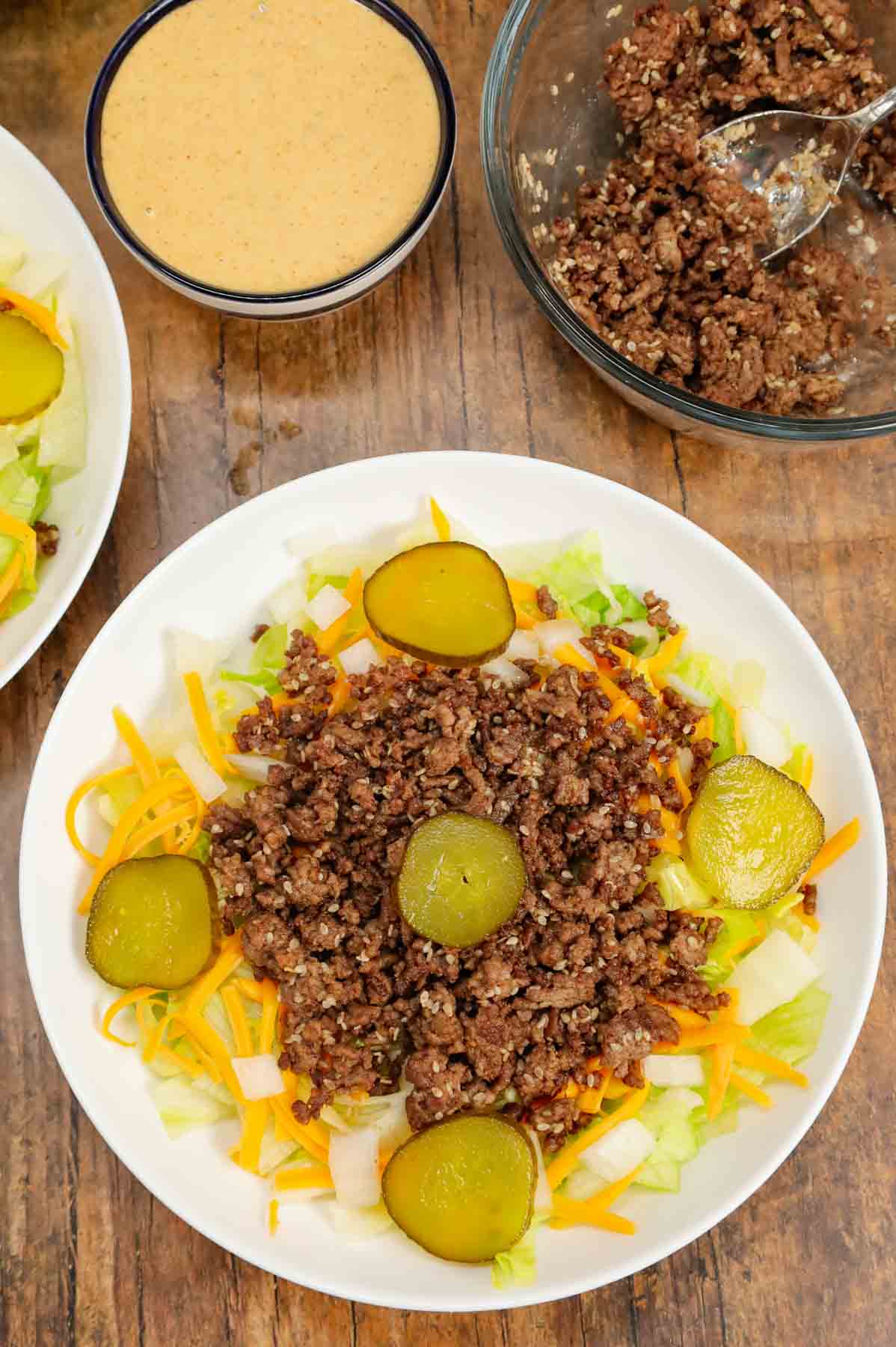 big mac salad on a plate before adding dressing