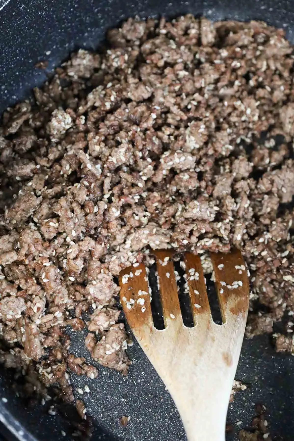 cooked ground beef and sesame seeds in a skillet