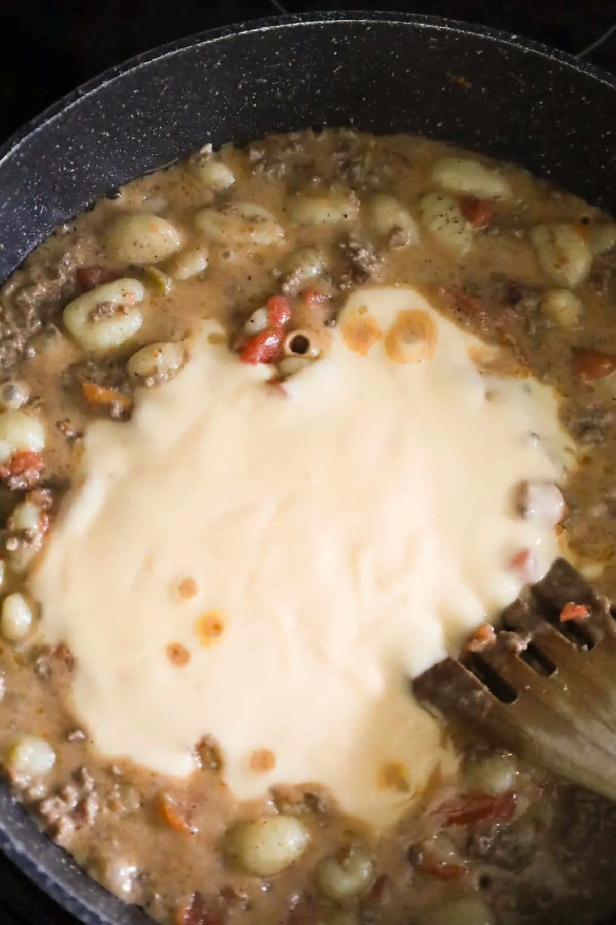 cheddar soup added to skillet with ground beef and gnocchi mixture