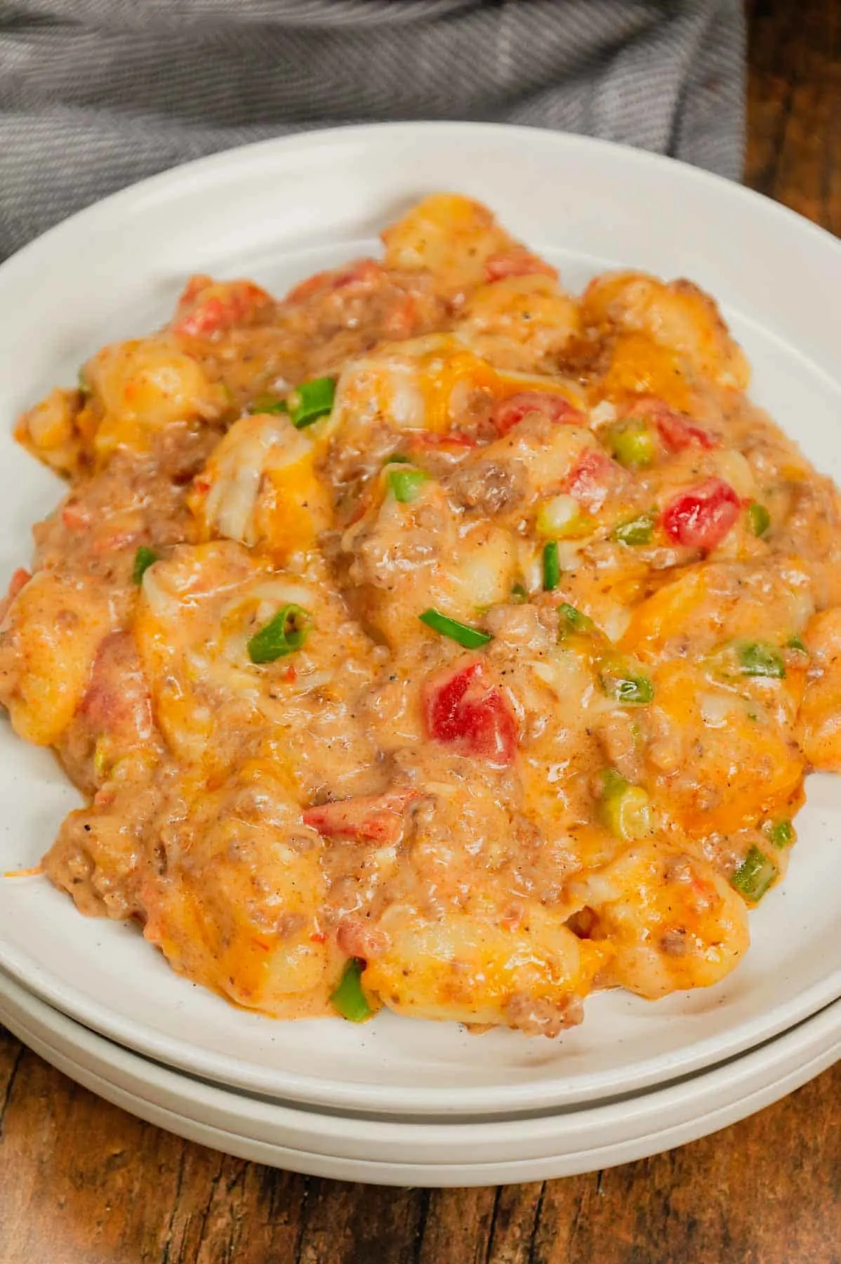 Cheeseburger Gnocchi is a hearty ground beef dinner recipe loaded with potato gnocchi, Rotel, chopped green onions and shredded cheese with a creamy sauce made from cheddar soup and milk.