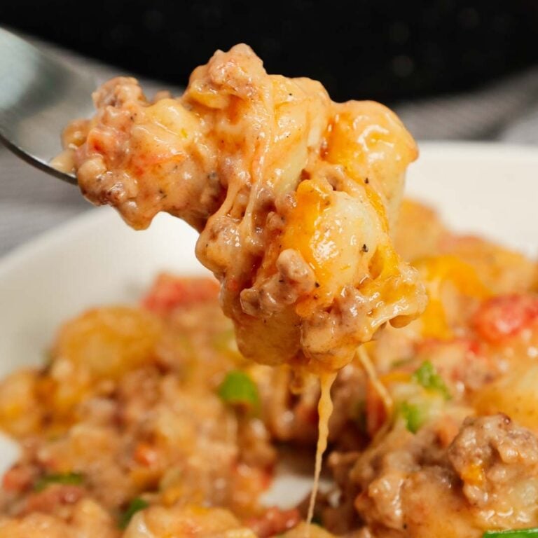 Cheeseburger Gnocchi is a hearty ground beef dinner recipe loaded with potato gnocchi, Rotel, chopped green onions and shredded cheese with a creamy sauce made from cheddar soup and milk.