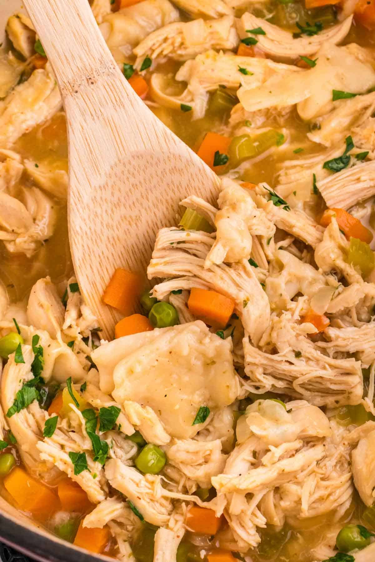 Chicken and Dumplings with Tortillas is a twist on a classic comfort food recipe loaded with shredded chicken breast, carrots, celery, onion, peas and flour tortilla recipes all cooked in a delicious chicken broth.