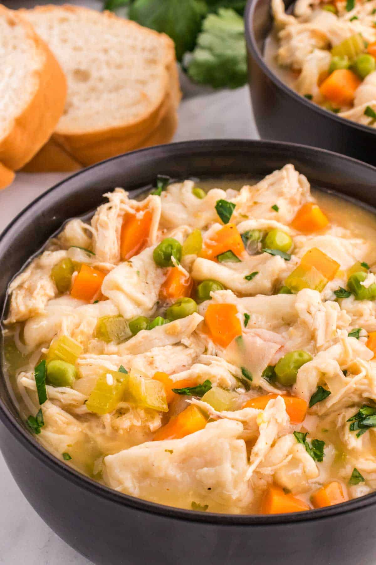 Chicken and Dumplings with Tortillas is a twist on a classic comfort food recipe loaded with shredded chicken breast, carrots, celery, onion, peas and flour tortilla recipes all cooked in a delicious chicken broth.