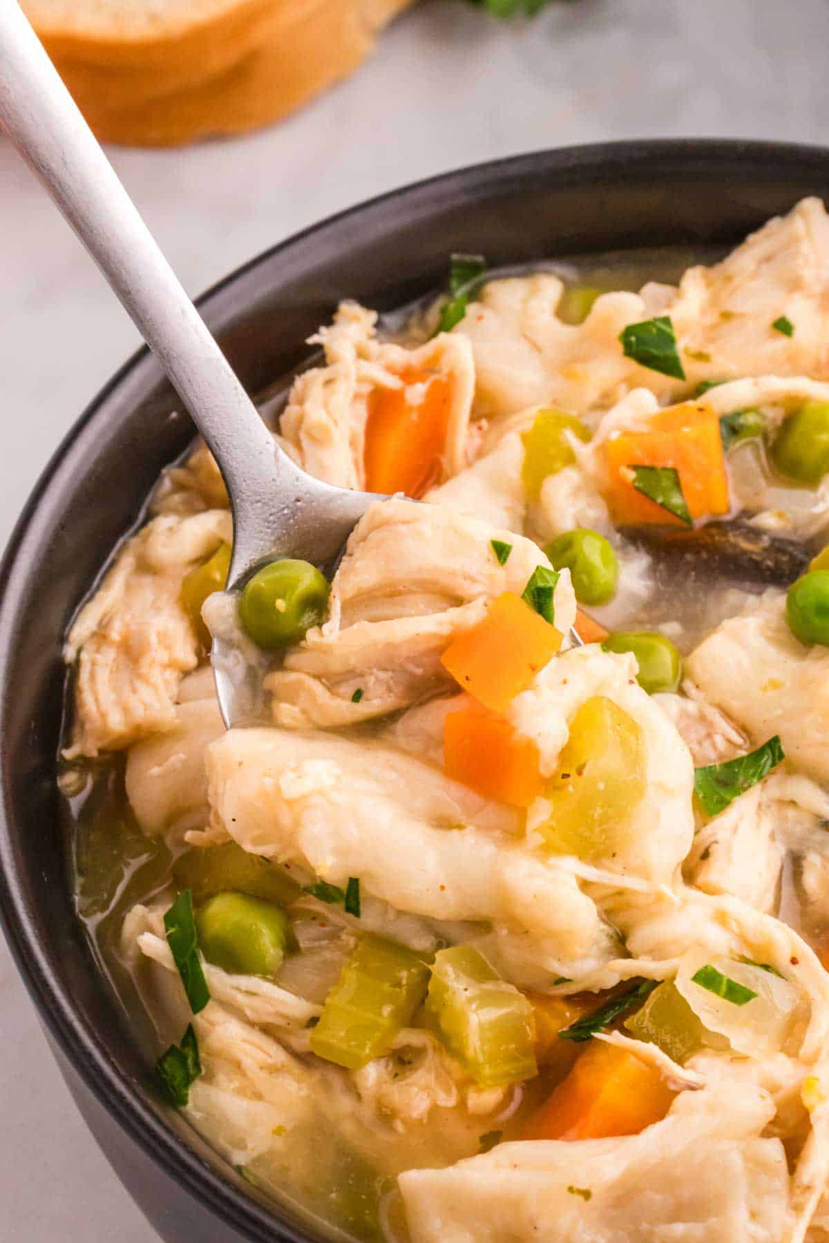 Chicken and Dumplings with Tortillas is a twist on a classic comfort food recipe loaded with shredded chicken breast, carrots, celery, onion, peas and flour tortilla recipes all cooked in a delicious chicken broth.