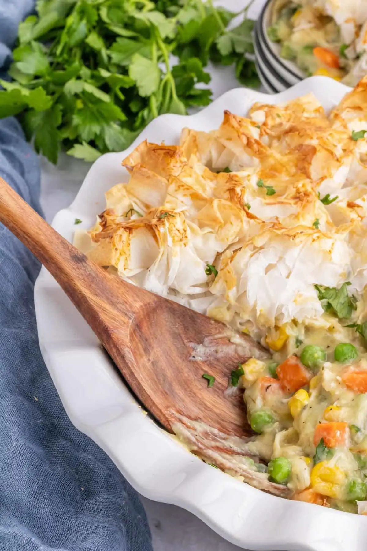 Chicken Pot Pie with Phyllo Dough is a hearty dinner recipe using shredded rotisserie chicken, frozen mixed vegetables, cream of chicken soup and sheets of phyllo dough.