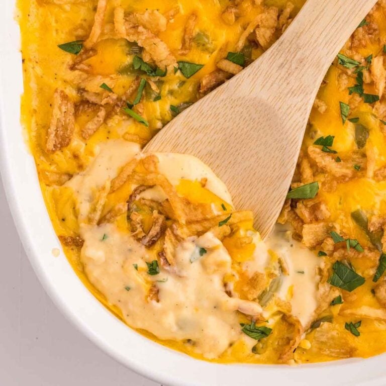Green Bean Casserole with Velveeta is a classic holiday side dish made with canned green beans, cream of mushroom soup, Velveeta, shredded cheddar cheese and French's crispy fried onions.