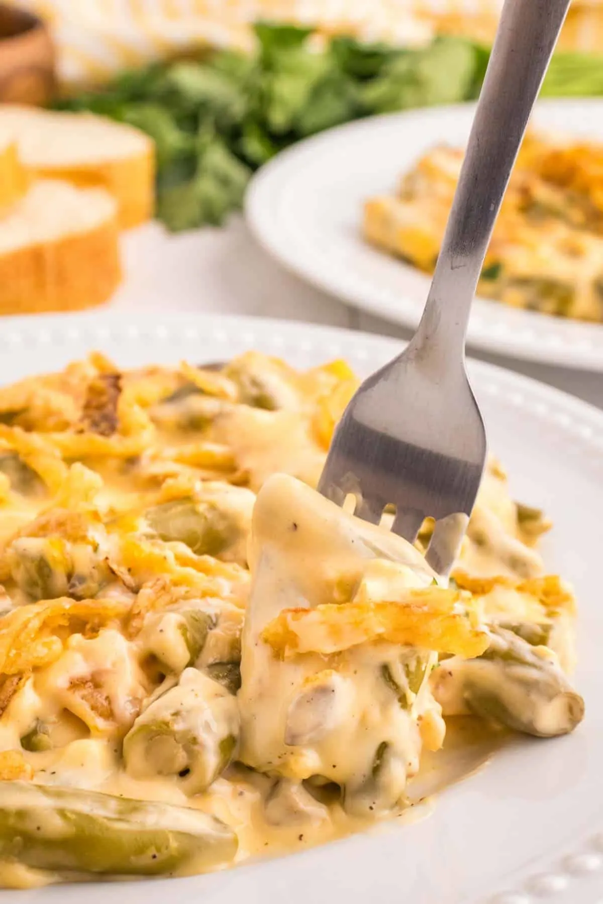 Green Bean Casserole with Velveeta is a classic holiday side dish made with canned green beans, cream of mushroom soup, Velveeta, shredded cheddar cheese and French's crispy fried onions.