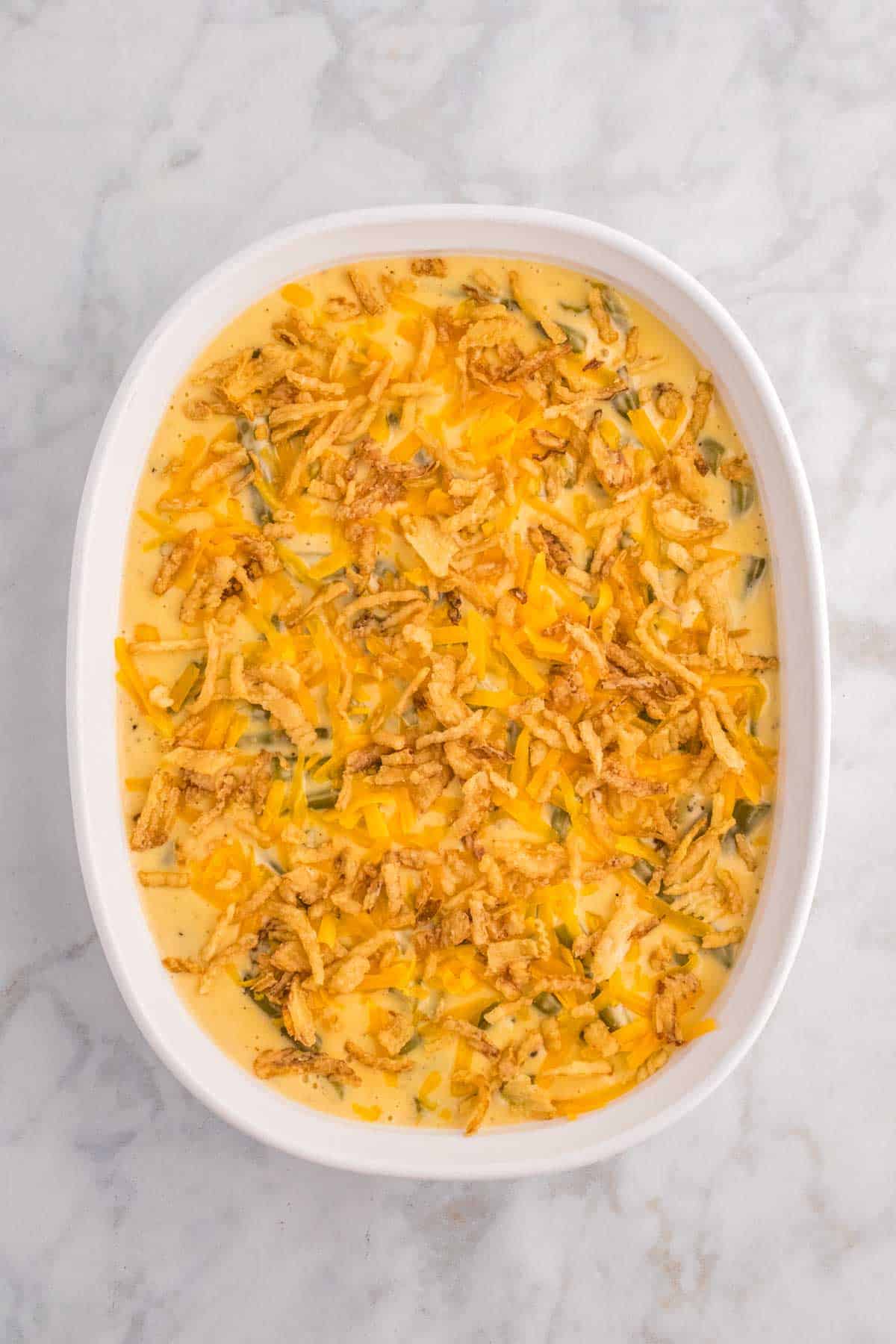 French's crispy fried onions sprinkled on top of green bean casserole before baking