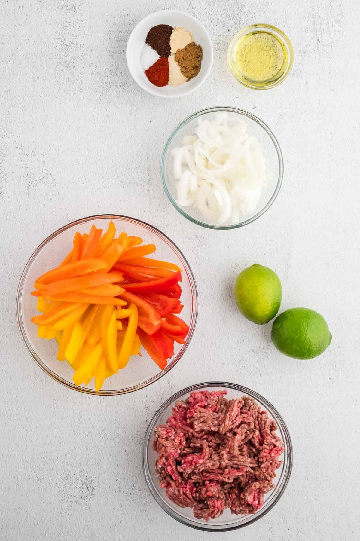 ground beef fajita ingredients in prep bowls