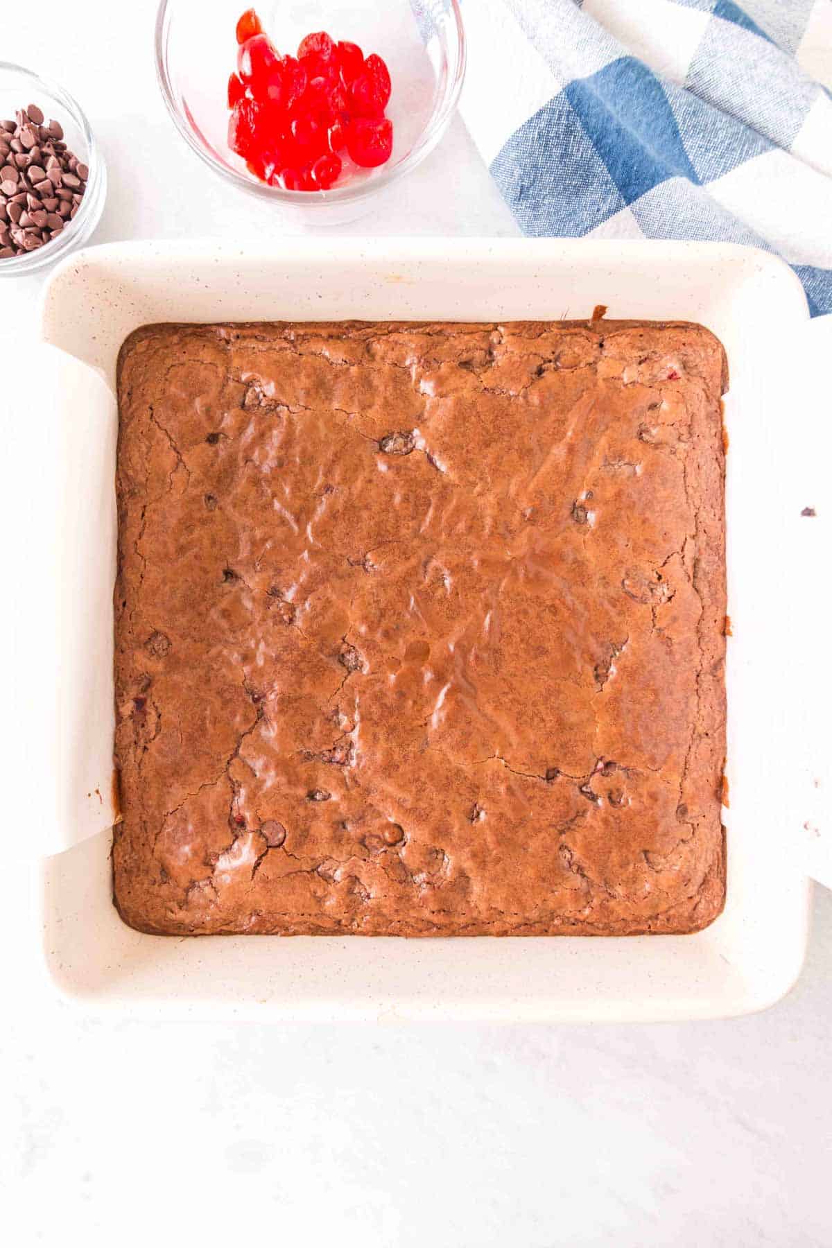 baked brownies in a parchment ined pan