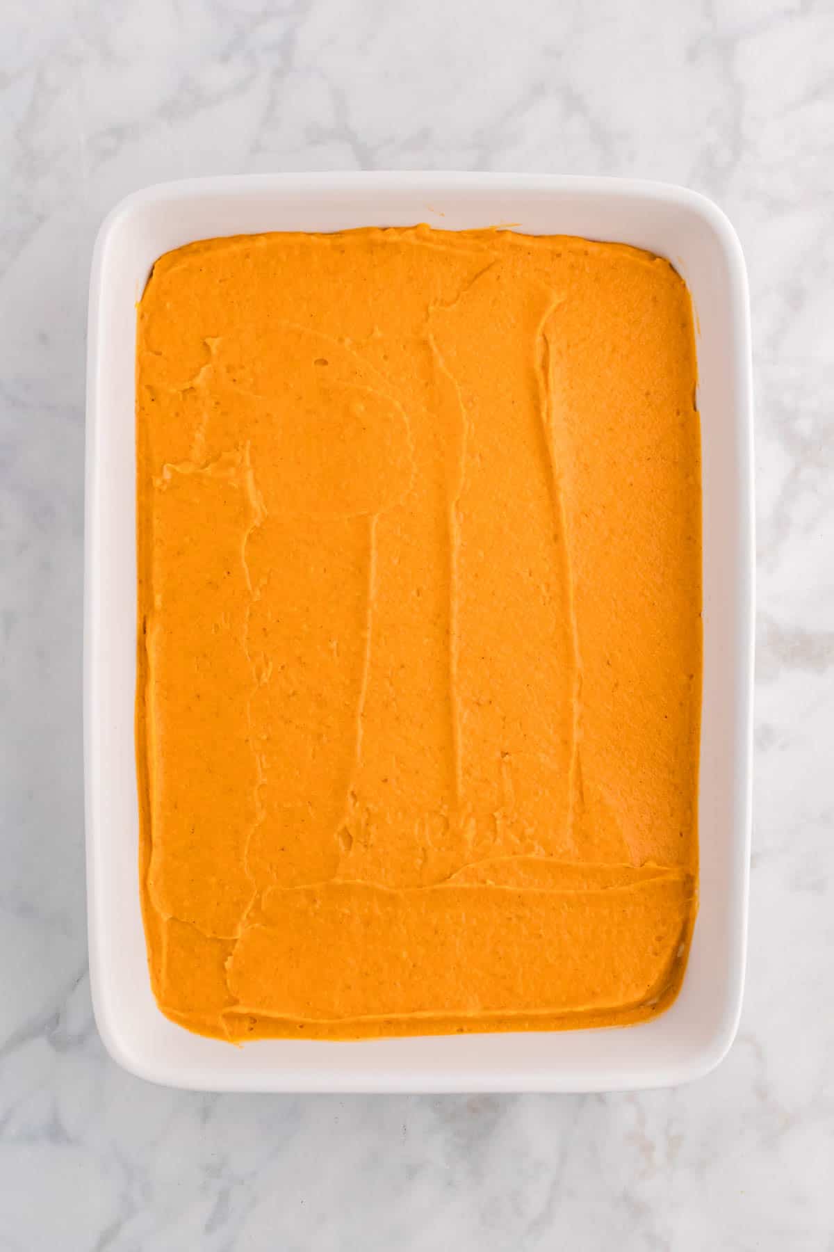 pumpkin pudding layer in a baking dish